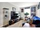 Cozy living room with Star Wars memorabilia, TV and comfortable blue sofa at 1286 Brookdale Ct, Franklin, IN 46131
