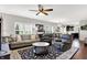 Spacious living room featuring comfortable seating, an area rug, and large windows at 1286 Brookdale Ct, Franklin, IN 46131
