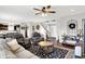 Open-concept living room with views of the foyer, staircase, and dining area at 1286 Brookdale Ct, Franklin, IN 46131