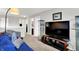 Bright living room featuring a TV with display shelving, access to bath and bedroom at 1286 Brookdale Ct, Franklin, IN 46131