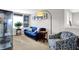 A cozy living room with neutral carpet and a comfortable blue couch at 1286 Brookdale Ct, Franklin, IN 46131