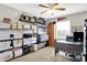 Organized office space with ample storage, a desk, and natural light from the window at 1286 Brookdale Ct, Franklin, IN 46131