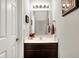 A charming powder room featuring a decorative mirror and a stylish vanity at 1286 Brookdale Ct, Franklin, IN 46131