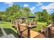 Multi-level backyard deck featuring a gazebo and outdoor seating, perfect for entertaining guests at 12945 E 100 N, Columbus, IN 47203