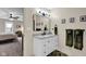 Modern bathroom features a white vanity with marble countertop and framed mirror at 12945 E 100 N, Columbus, IN 47203