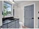 Bathroom featuring granite counters, modern fixtures, and a well-lit vanity mirror at 12945 E 100 N, Columbus, IN 47203