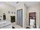 Well-lit bathroom with white marble sink, a toilet, and wooden storage cabinet at 12945 E 100 N, Columbus, IN 47203