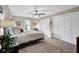 Bright bedroom offers neutral walls, carpeted floors, and great closet space for optimal storage at 12945 E 100 N, Columbus, IN 47203