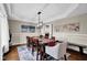 Elegant dining room featuring a decorative ceiling, modern lighting fixture, and stylish decor at 12945 E 100 N, Columbus, IN 47203