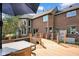 Exterior back view of brick home with tiered deck and backyard, excellent for gatherings and relaxation at 12945 E 100 N, Columbus, IN 47203