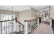Bright foyer with staircase, wrought iron railing, and natural light at 12945 E 100 N, Columbus, IN 47203