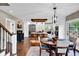 Bright, open kitchen with stainless steel appliances, a kitchen island, and a breakfast nook at 12945 E 100 N, Columbus, IN 47203