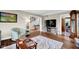 Spacious living room with hardwood floors, and large windows for natural light at 12945 E 100 N, Columbus, IN 47203