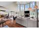 Open concept living room with hardwood floors, fireplace, and large windows for natural light at 12945 E 100 N, Columbus, IN 47203