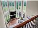 Spacious living room with fireplace, floor to ceiling windows and comfortable seating at 12945 E 100 N, Columbus, IN 47203