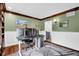 Well-lit home office with custom shelving, wood trim and large windows at 12945 E 100 N, Columbus, IN 47203