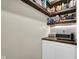 Pantry featuring custom wood shelving and cabinet storage at 12945 E 100 N, Columbus, IN 47203