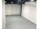 Unfinished basement offering a blank canvas and opportunity for customization with painted floors and walls at 1417 N Belleview Pl, Indianapolis, IN 46222