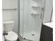 Modern bathroom featuring a glass enclosed shower and contemporary toilet at 1417 N Belleview Pl, Indianapolis, IN 46222