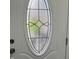 Close up shot of entry door's decorative glass with black trim and metal hardware at 1417 N Belleview Pl, Indianapolis, IN 46222