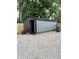 Detached gray garage with black trim and gravel surround offers ample space and exterior appeal at 1417 N Belleview Pl, Indianapolis, IN 46222
