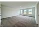 Expansive bedroom with soft carpet, multiple windows that fill the room with natural light, and neutral walls at 1534 Trichel Dr, Greenwood, IN 46143