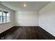 Bright bedroom featuring hardwood floors, a large window that fills the room with natural light, and neutral walls at 1534 Trichel Dr, Greenwood, IN 46143