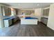 Spacious kitchen featuring gray cabinets, expansive countertops, and a large center island at 1534 Trichel Dr, Greenwood, IN 46143