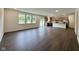 Open-concept living room boasts hardwood floors, recessed lighting, and a sliding glass door to the backyard at 1534 Trichel Dr, Greenwood, IN 46143