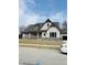 Charming two-story home boasts a modern design and a welcoming front entrance at 15434 Spring Winds Dr, Carmel, IN 46033