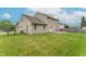 Expansive backyard features a wooden deck and a secure fence, ideal for outdoor gatherings and privacy at 1603 Quinn Creek Dr, Brownsburg, IN 46112