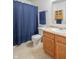 Functional bathroom featuring a vanity, sink, toilet, and blue shower curtain at 1603 Quinn Creek Dr, Brownsburg, IN 46112