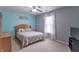 Comfortable bedroom featuring a bed, a dresser, and natural light at 1603 Quinn Creek Dr, Brownsburg, IN 46112