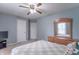 Well-lit bedroom featuring a bed, dresser, and a tranquil color scheme at 1603 Quinn Creek Dr, Brownsburg, IN 46112