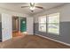 Cozy bedroom features ample natural light, a ceiling fan, and easy access to other rooms at 1603 Quinn Creek Dr, Brownsburg, IN 46112
