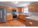 Well-lit kitchen with stainless steel appliances, wooden cabinets, and ample counter space for cooking and preparation at 1603 Quinn Creek Dr, Brownsburg, IN 46112