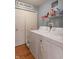 Efficient laundry area equipped with washer, dryer, and storage shelves at 1603 Quinn Creek Dr, Brownsburg, IN 46112