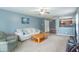 Bright living room with comfortable seating, wood accents and convenient access to the kitchen through an open floor plan at 1603 Quinn Creek Dr, Brownsburg, IN 46112