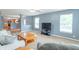 Cozy living room showcasing comfortable seating, a modern entertainment center, and a seamless connection to the kitchen at 1603 Quinn Creek Dr, Brownsburg, IN 46112