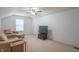 Cozy living room featuring comfortable seating and a modern entertainment center at 1603 Quinn Creek Dr, Brownsburg, IN 46112