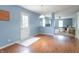 Bright and airy open-concept room showcasing laminate flooring and easy access to the back yard at 1603 Quinn Creek Dr, Brownsburg, IN 46112