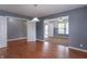 Spacious living room with hardwood floors and a view into another room, creating an open and airy feel at 1603 Quinn Creek Dr, Brownsburg, IN 46112