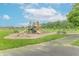 Community playground with slides, swings, picnic tables, and benches surrounded by green space at 1603 Quinn Creek Dr, Brownsburg, IN 46112