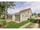 Large backyard featuring a detached garage, and green grass at 1609 S G St, Elwood, IN 46036