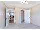 Neutral bedroom featuring an open closet, an ensuite area, and plush carpet at 1609 S G St, Elwood, IN 46036