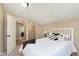 Bedroom features an ensuite area, a view to closet, and a bed with stylish decor at 1609 S G St, Elwood, IN 46036