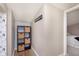Hallway features a built-in organizer and a view into the decorated bedroom at 1609 S G St, Elwood, IN 46036