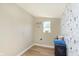 Clean laundry room with patterned wallpaper at 1609 S G St, Elwood, IN 46036