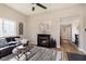 Relaxing living room features a fireplace, a plush leather couch, and stylish decor at 1609 S G St, Elwood, IN 46036