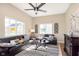 Bright living room with high ceilings, sleek leather sofas, and an electric fireplace at 1609 S G St, Elwood, IN 46036